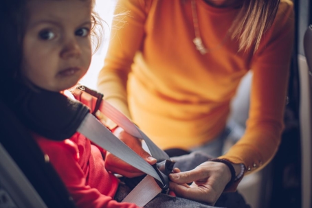 Sad child in Car with Mother